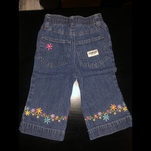 Infant Oshkosh jeans with floral accents